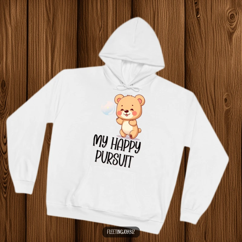 Funny Bear Cub Hoodie featuring a tiny bear cub delightedly chasing a shiny bubble, perfect for cozying up with a smile.